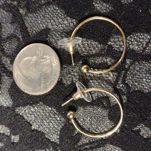 Quarter size, 3/4 " around , gold plated hoop earrings.